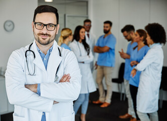 Wall Mural - doctor medicine health care hospital specialist physician uniform portrait medical team clinic man smiling