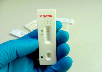 Poster - Scientist hold a test device or cassette for Troponin I test. Rapid screening test, myocardial infraction