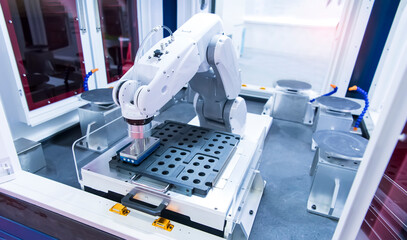 Wall Mural - robotic arm catch for electronic assembly line. The robot for smart technology manufacturing process.