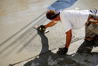 © Mel Stoutsenberger - Mason smoothing fresh concrete