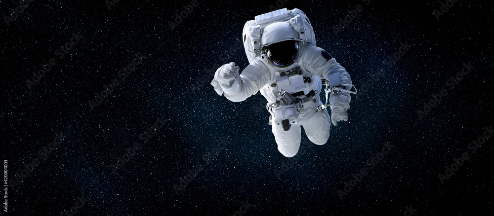Astronaut spaceman do spacewalk while working for space station in outer space . Astronaut wear full spacesuit for space operation . Elements of this image furnished by NASA space astronaut photos. - obrazy, fototapety, plakaty 