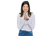 © Krakenimages.com - Beautiful brunette woman wearing casual clothes praying with hands together asking for forgiveness smiling confident.