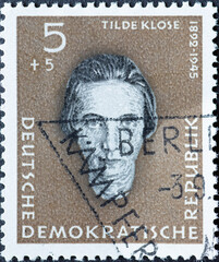 Wall Mural - GERMANY, DDR - CIRCA 1959 : a postage stamp from Germany, GDR showing a portrait of the resistance fighters against Hitler by the trade unionist Tilde Klose (1892–1945). Ravensbrück Memorial