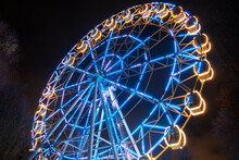 Ferris Wheel At The Fair Ground At Night.