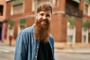 Wall Mural - Young irish hipster man smiling happy standing at the city.