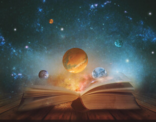 book of the universe - opened magic book with planets and galaxies. elements of this image furnished