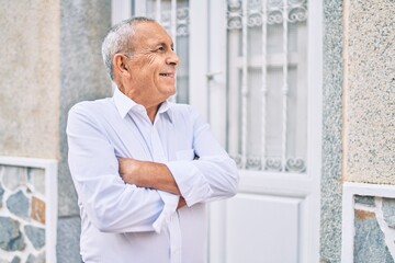 Wall Mural - senior man smiling happy walking at the city.