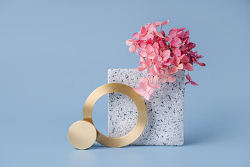 Wall Mural - stone plate with flowers and golden elements on a blue background. stylish background with geometric