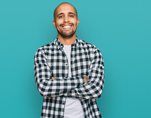 Poster - Hispanic adult man wearing casual clothes happy face smiling with crossed arms looking at the camera. positive person.