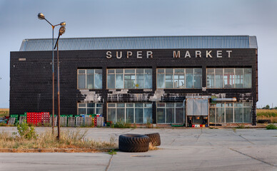 Abandoned building of an old supermarket left to decay. 