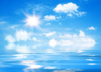 Wall Mural - natural sunny background, blue sky with white cumulus clouds and shining sun.