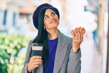 Wall Mural - Young beautiful woman wearing french style having breakfast at the city.