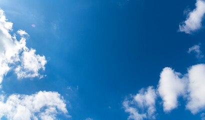 Beautiful blue sky with fluffy white clouds. Sky backgrounds.