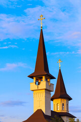 Wall Mural - Tower with belfry and spire . Church top architecture details 