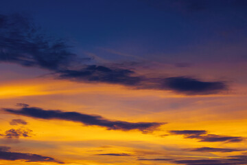 Wall Mural - dark clouds on the glowing sky at sunset. dramatic nature scenery on the windy weather in evening