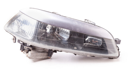 Poster - Stylish xenon right headlight of a German car - optical equipment with a lamp inside on a white isolated background. Spare part for auto repair in a car workshop.