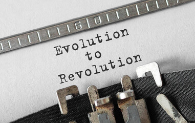 Wall Mural - Text Evolution to Revolution typed on retro typewriter