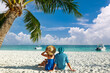 Leinwandbild Motiv Couple in blue clothes on a beach at Maldives