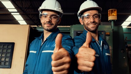 two skillful factory engineer or worker showing teamwork and partnership . industrial people and man