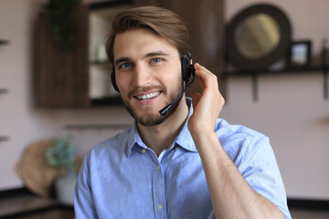 Sticker - Cheerful young support phone male operator in headset, at workplace while using laptop