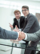 © ASDF - close up. business handshake in a modern office .