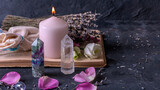 Magic still life with fluorite, quartz crystal and pink candle. Magic rocks for mystic ritual, witchcraft Wiccan or spiritual practice (healing). Meditation reiki. Ritual for love and chakra balance.