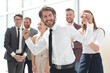 © ASDF - happy young businessman on business team background.