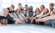 © ASDF - multinational group of young people joining their palms