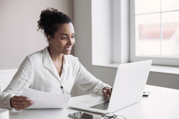 Sticker - Young woman using laptop computer at office. Student girl working at home. Work or study from home, freelance, business, lifestyle concept