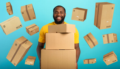 Wall Mural - Happy boy receives a lot of packages from online shop order. Blue background.