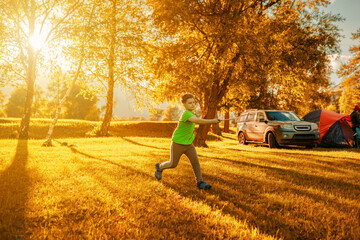 Wall Mural - one young boy playing in badminton outdoors