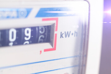 macro view of electricity watt meter, kilowatt calculator counter at home, savings economy