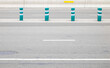 © Azazello - Four safety control plastic poles on highway.