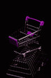 Shopping cart on shopping basket. Modern retail and commerce minimal concept with purple accent colour