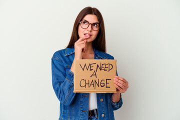 Young caucasian woman holding protect our planet placard isolated dreaming of achieving goals and purposes