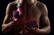 © be free - what is inside. love gift for date. passion and desire. man ready to erotic games. happy valentines day. sexual toys. lover naked body. be my valentine. protect yourself. sexy macho man with present