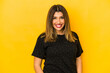 © Asier - Young indian woman isolated on yellow background looks aside smiling, cheerful and pleasant.