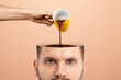 © Aliaksandr Marko - The man's head is open and coffee is poured into it from a cup. Creative background, coffee lover, brain drug, caffeine.