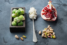 Brussels Sprouts, With Pomegranate, Cottage Cheese And Pistachios, On  Grey Background