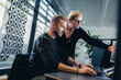 © Jacob Lund - Manager assisting colleague working in office