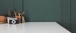 Leinwandbild Motiv Home office desk with dark green wall and white table mock up.	