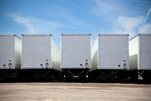 Row Of Transport Truck Trailers In A Yard