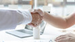 © Puwasit Inyavileart - Two men holding hands, Asian doctor smiled shake hands with the patient congratulating him on being healthy and strong, Successful treatment, Hold hands, Handshake, shook hands.