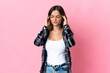 © luismolinero - Young Romanian woman isolated on pink background with headache