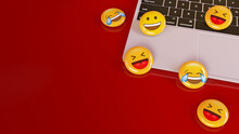 Some Laughing And Smiling Emoji Pills Over A Notebook In Red Background - 3D Rendering