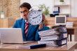 © Elnur - Young male employee in time management concept