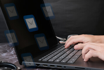 businessman hand working on laptop computer and new normal social distancing, work from home concept