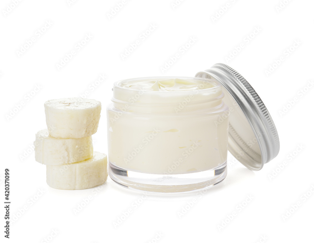 Jar of natural banana cream on white background