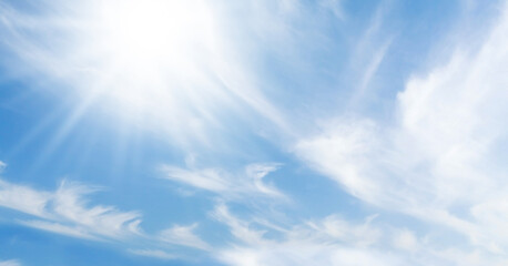 Wall Mural - blue sky with light clouds and bright sun