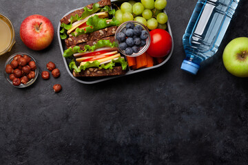 Wall Mural - Healthy school lunch box with sandwich and fresh vegetables